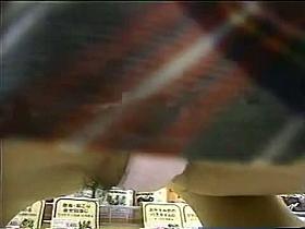 A tempting upskirt shot of a middle aged woman