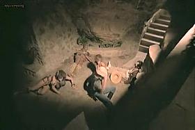 Naked cavegirl with perky tits in movie clip