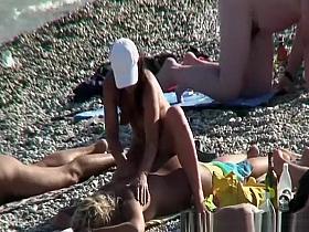 Nude woman puts lotion and massages backs