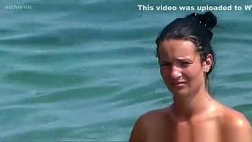 Topless woman in see