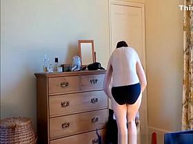 Mature woman changing in bedroom