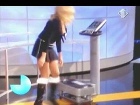 Blonde woman with big juggs gives the audience an eyeful of her melons and ass