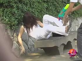 Dressed all in white got wet by the water gun sharking video