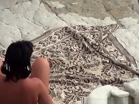 Two nude men fuck nudist at beach