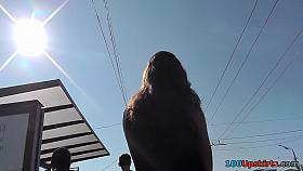 Beautiful brunette girl was waiting a bus and upskirted