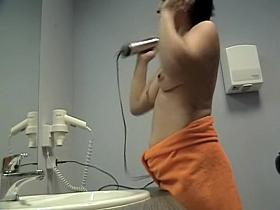 Topless changing room woman with the hairdryer