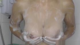 Sexy ass brunette talks on the phone with downblouse on