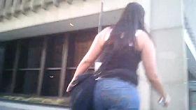 Candid brunette wearing glasses with BIG ass in jeans