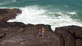 Two naughty girls drive to a desolate spot on the beach
