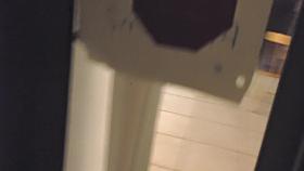 Girl in the window is sitting naked on the sofa