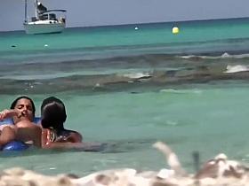 Topless sisters spied on an air mattress