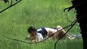 A boy with a girl having sex on a public place