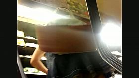 Sweet babe leans forward and presents us free upskirt scene