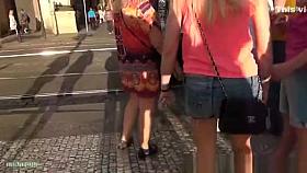 Girl in denim shorts waiting for crossing road