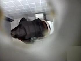 Ceiling cam films a girl peeing in the toilet