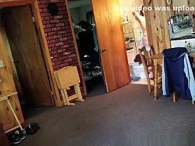 Chubby wife combing her hair in bathroom