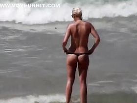 Blonde woman topless with small boobs