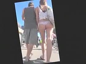 Beautiful coquette walks around the town in flimsy tights