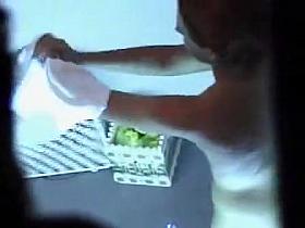 Cute chubby girl lotions up before a tan