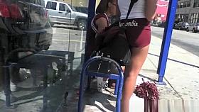 Teen cheerleaders waiting for bus