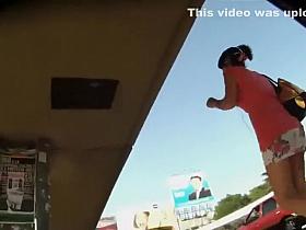 Peeking under her flowery short skirt