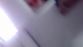 Asian fills glass of piss