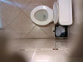 Hidden cam in public toilet ceiling