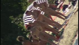 Mature babes with sexy bottoms move naked on the beach