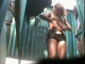 Real voyeur beach changing room video starring two girls demonstrating theit tits