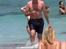 Big natural tits woman topless in the beach