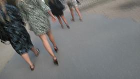 Candid young blond, sexy legs in wedges heels