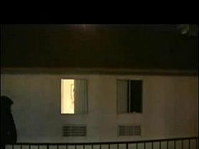 Neighbor spied topless in her bedroom