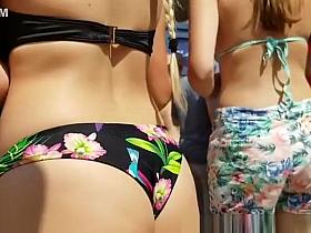 Teens in tight jeans shorts and bikini walking