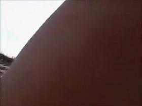 Horny daddy pisses and jerks off his penis on a black babe at the beach