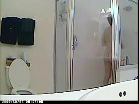 Milf soaping and shaving her body in the shower