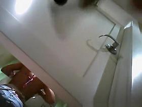 Cute brunette trying on swimsuit