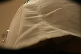 Sexy babe filmed upskirt by a voyeur guy from behind