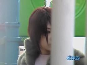 Shy Japanese trick playing with her phone during sharking attack