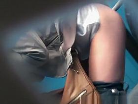 Portable public toilet pissing woman