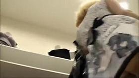 Sexy butt in panties under a short skirt