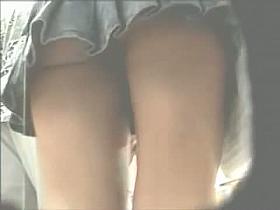 Gorgeous babes filmed upskirt by a voyeur guy