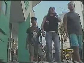 Summer girl with pony tails and jeans skirt voyeur video