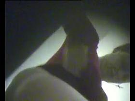 A man shoots his girlfiend changing clothes with the help of a voyeur spy cam