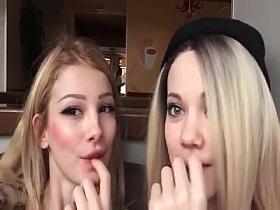 Two girls lezzing in public cafe