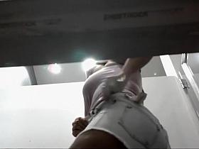 Thick woman tries to get into shorts