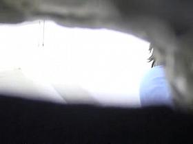 Brunette caught in public toilet peeing