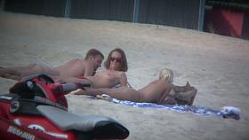 Sexy blonde and naughty brunette on nude beach