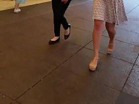 Sexy white girl walking with decent short one.