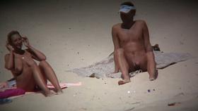 Big breasted woman meeting a hunk on the nude beach