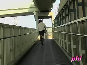 Leggy oriental hottie flashes her underwear when somebody pulls her skirt